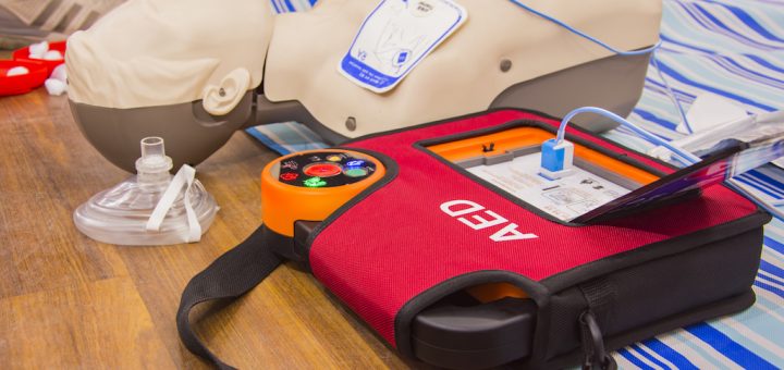 A defibrillator being used during first aid & CPR training
